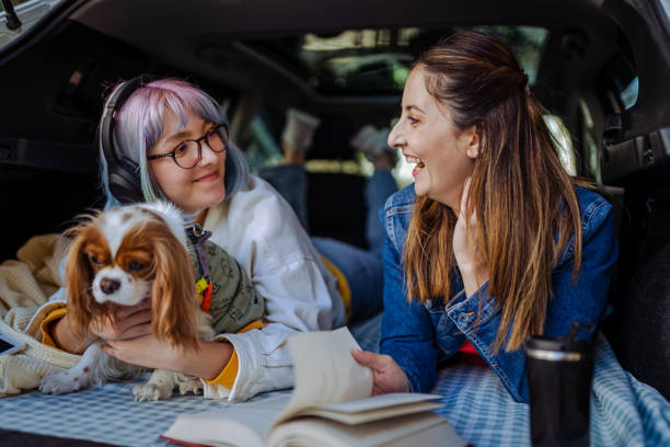 istock Happy family and their dog going on a car trip in spring. 1390706619
