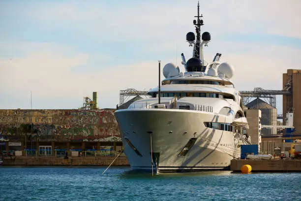 Photo of Tarragona, Spain - April 6, 2019: Luxury yacht parked in Port.