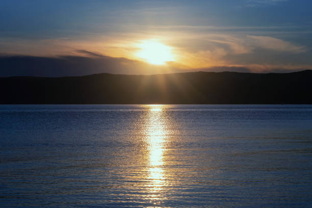 istock Beautiful sunset on lake Baikal in the summer. 1390711729