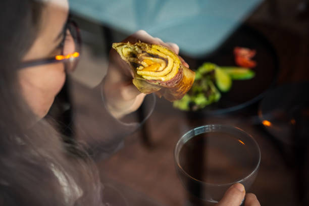 Woman Eating Burrito