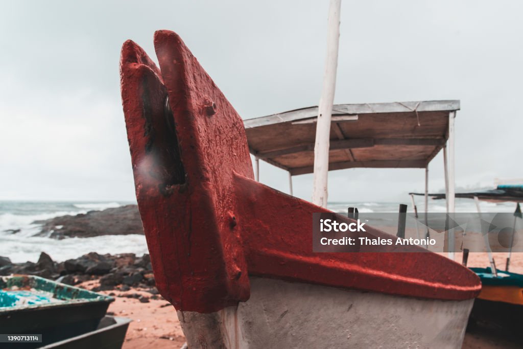 Fishing boats moored on the sands of Rio Vermelho beach. Salvador, Bahia, Brazil - November 15, 2021: Fishing boats moored on the sands of Rio Vermelho beach. Salvador, Bahia, Brazil. Atlantic Ocean Stock Photo