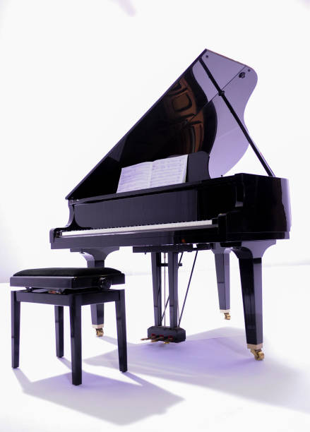 istock black grand piano on white background 1390715300