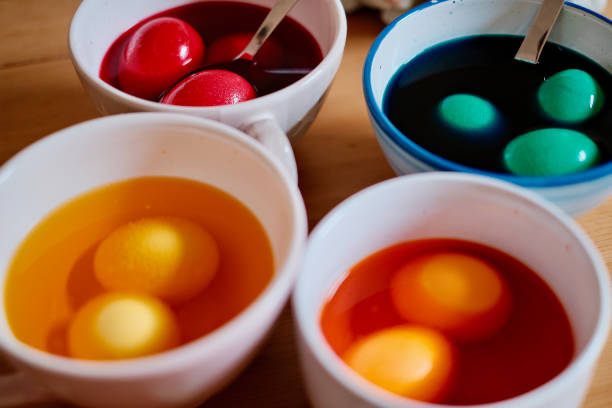 istock Coloring Easter eggs with my family 1390716526