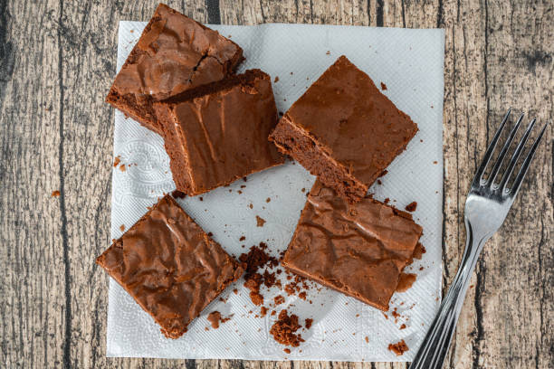 istock Homemade chocolate brownie squares on a table. 1390716862