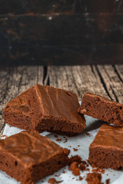 istock Homemade chocolate brownie squares on a table. Vertical orientation. Copy space 1390716865