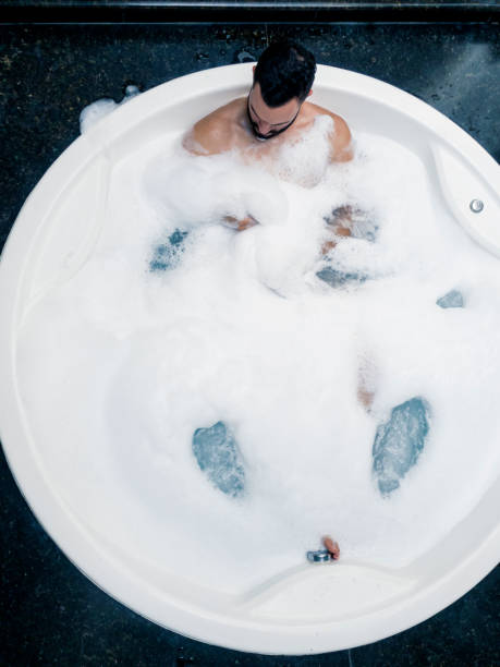istock Man in the bathtub. 1390718073