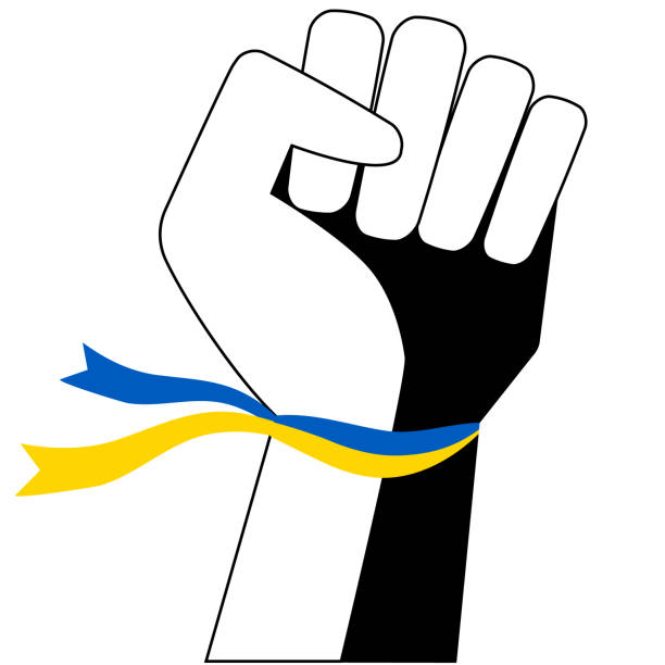 権利と自由のための闘争の象徴である拳に握り締められた手は、ウクライナの国旗の色のリボンです。 - freedoms点のイラスト素材／クリップアート素材／マンガ素材／アイコン素材