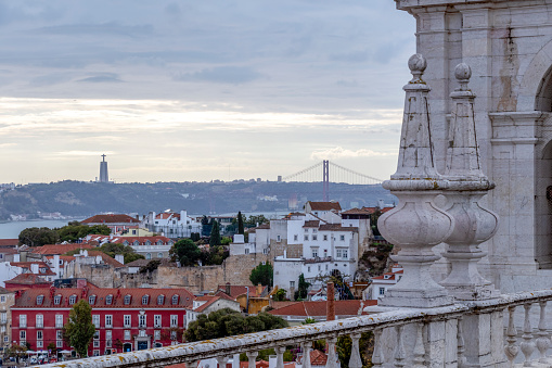 Monastery of Saint Vincent de Fora and panoramic view of Lisbon city center with landmarks and red roofs of the city center, Lisbon, Portugal