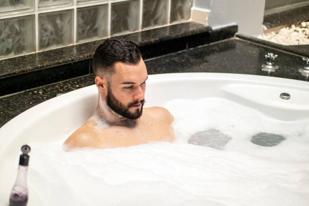 istock Man in the bathtub. 1390723369