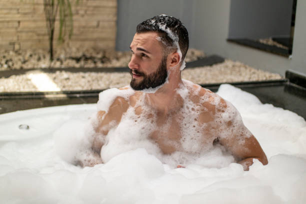 istock Man in the bathtub. 1390723379