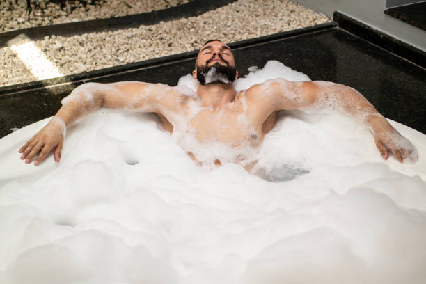 istock Man in the bathtub. 1390723389