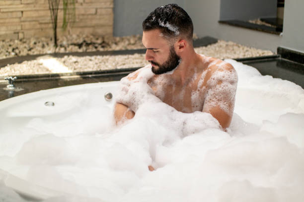 istock Man in the bathtub. 1390723501