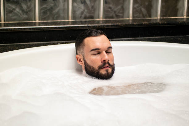 istock Man in the bathtub. 1390723549
