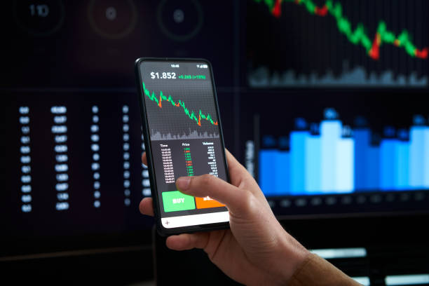 istock Closeup hand mobile decreasing graphs - Person is checking Bitcoin price chart on digital exchange on smartphone, cryptocurrency - Lose money, down, depression, collapse economy 1390724843