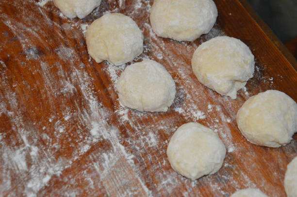 istock Cooking homemade whites with meat on yeast dough 1390725612