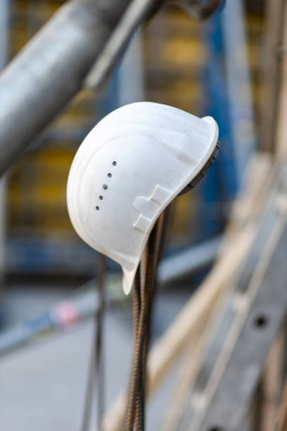 istock Close up of a safety helmet on a construction site 1390725843