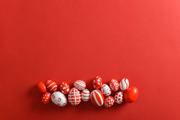 istock Easter banner with Easter red and white eggs on a bright red background. Space for copying. Flat position, top view 1390727049