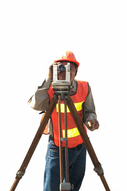 Engineer or surveyor working with theodolite  equipment at road construction site with isolated and clipping path.