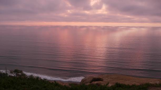 istock Dramatic sunset, sky and clouds. Torrey Pines, California coast, ocean sea water 1390730683
