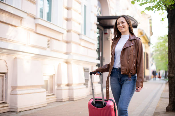 istock Tourist with her luggage 1390734233