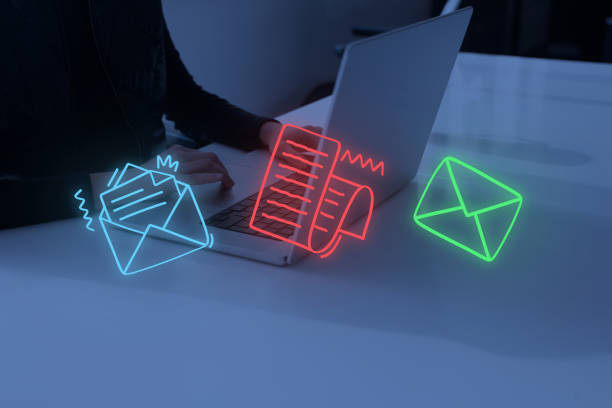 istock Woman using laptop with envelope icons 1390735862