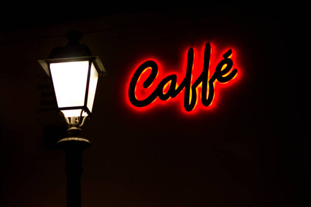 Neon light shaped into an arrow pointing left with the message \