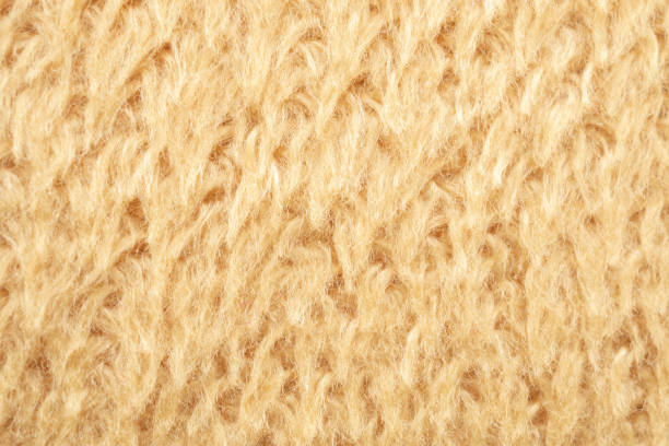 istock yellow fluffy fur fabric wool texture background 1390738749