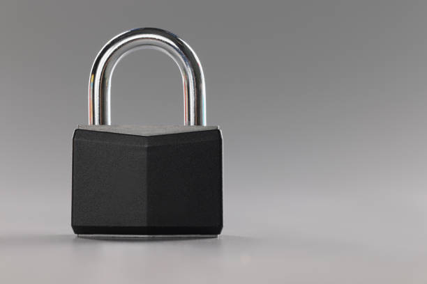Close-up of solid metal locked padlock, thing to protect home or apartment with, protection from break in. Safety, security, padlock concept. Copy space