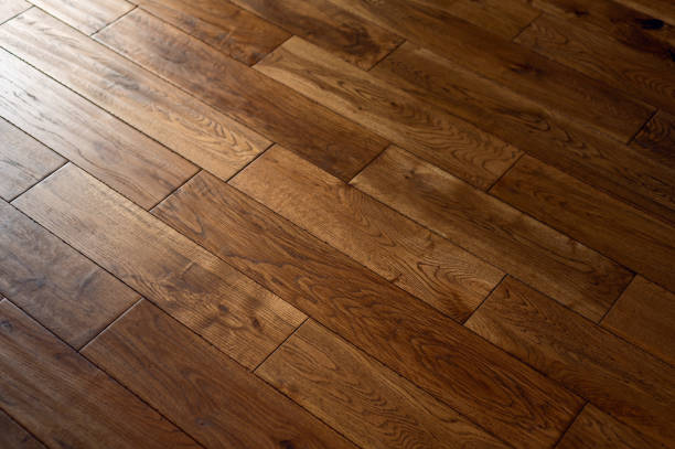 Solid oak wood flooring New flooring in the house. Beautiful golden handscraped oiled European oak brushed for added texture and fine definition of wood grain. flooring stock pictures, royalty-free photos & images