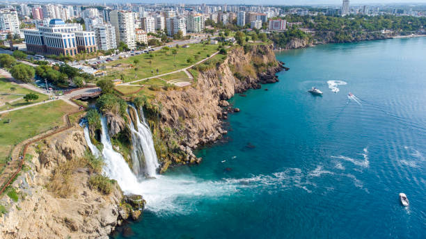 Waterfall Duden (Karpuzkaldiran selalesi) falling into the Mediterranean sea. Waterfall falling into sea. Waterfall stream. Aerial drone shooting. Antalya - Turkey