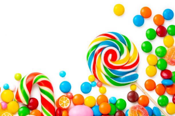 istock Colorful lollipops and different colored round candy. Top view. 1390739588
