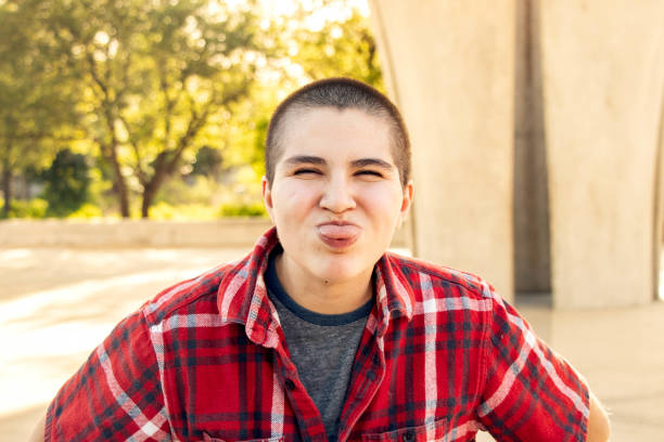 istock Portrait Sticking Tongue Out 1390742475