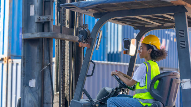 istock Young African American mechanical engineer with forklift 1390747436