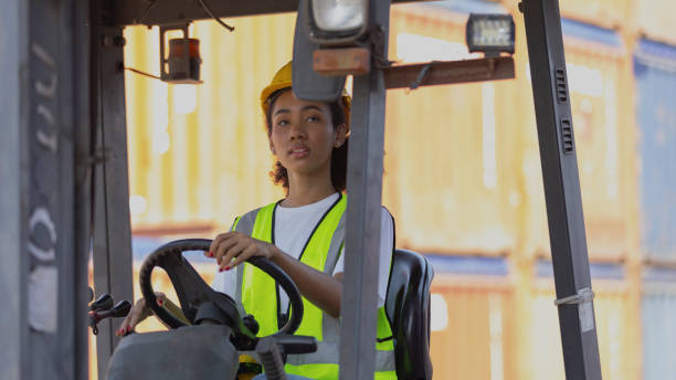 istock Young African American mechanical engineer with forklift 1390747437