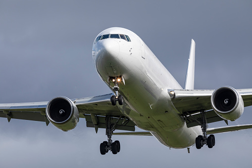 A Boeing 767 cargo plane landing at Portland.