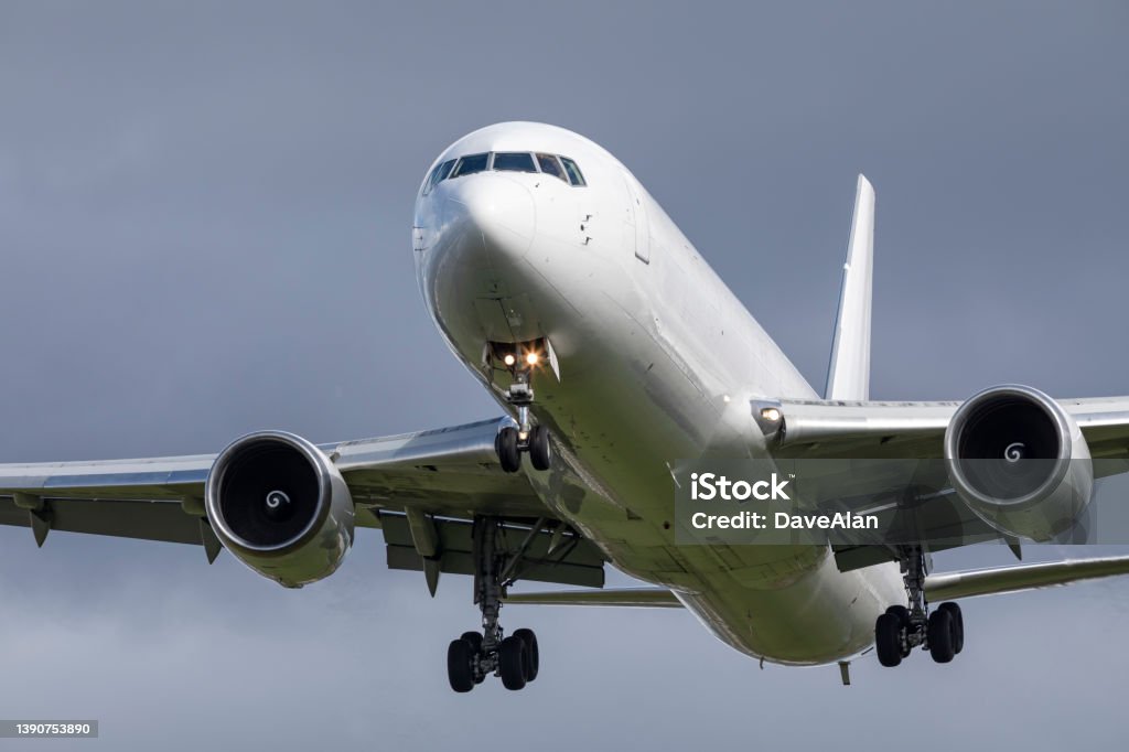White Cargo Boeing 767. A Boeing 767 cargo plane landing at Portland. Front View Stock Photo
