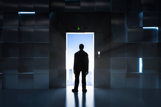 istock Business opportunity concept with businessman standing at elevator doors open 1390764638