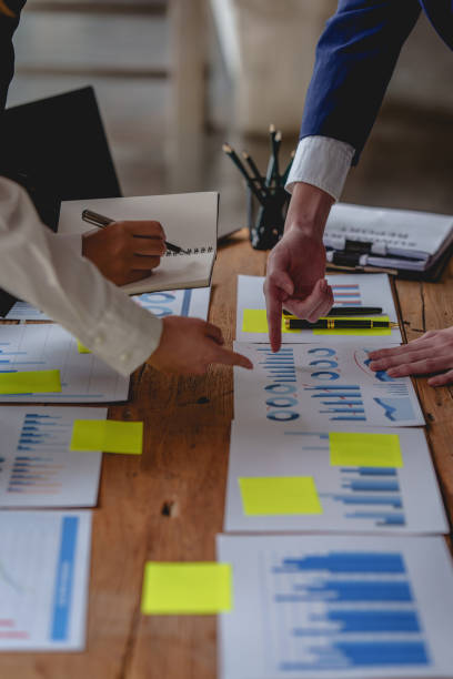 istock Analytics intelligence concept. Group of business people discuss current financial and economic on laptop for investment at the meeting. 1390765491
