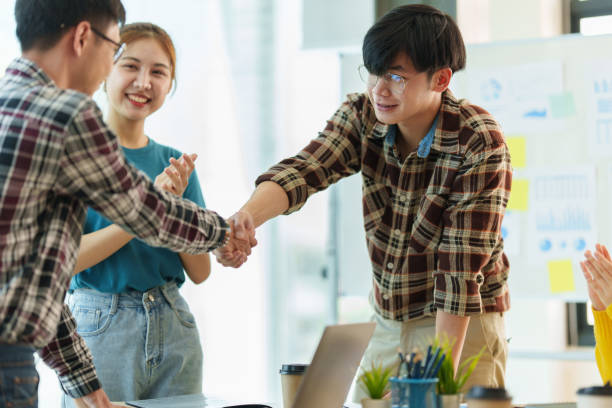 istock Business people successful negotiation and handshake. celebration partnership and teamwork, business deal concept. 1390765898