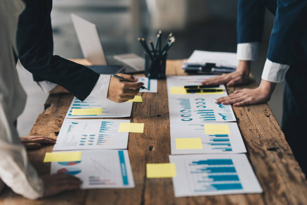 istock Business team hands at working with financial plan, meeting, discussion, brainstrom with tablet on office desk, Meeting concept. 1390765966