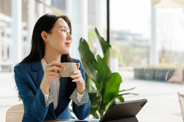 istock Coffee breaks for young Asian women 1390774851