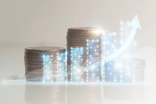 Coins piled up as levels gradually increased showing corporate business growth abstract, graph infographics economic stability reports, stability from sales development and white background investment