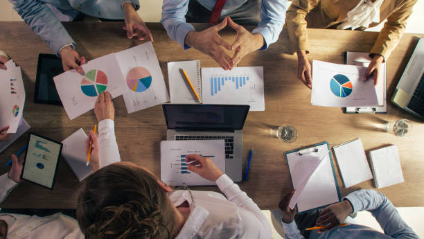 istock Business people reviewing data on documents during an important meeting 1390783554