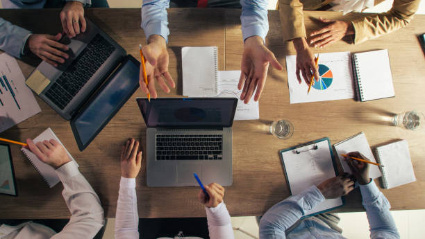 istock Business people gesturing while discussing ideas and strategizing during a meeting 1390783562
