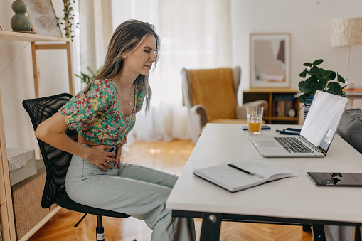 Young woman feeling stomach pain