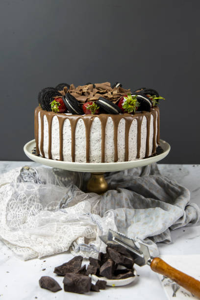 istock Strawberry and cocoa biscuit cake, Chocolate celebration cake on white surface, beautifully decorated celebration cake, 1390784386