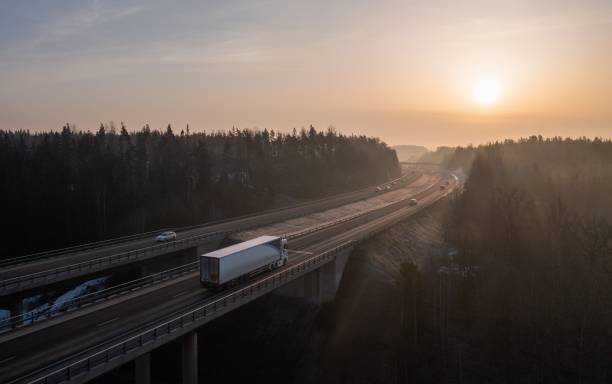 istock Cargo truck on a highway in spring morning. 1390786469