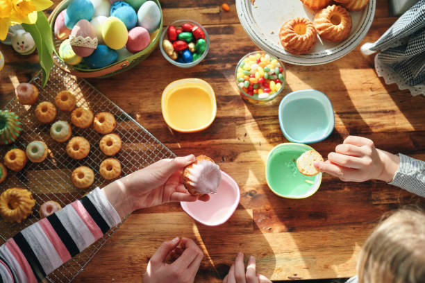 istock Two Girls Decorating Small Bundt Cakes with Sweets 1390788187