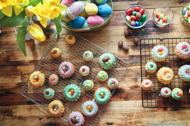 Small Bundt Cakes with Easter Eggs and Sweets Small Bundt Cakes with Easter Eggs and Sweets bunt stock pictures, royalty-free photos & images