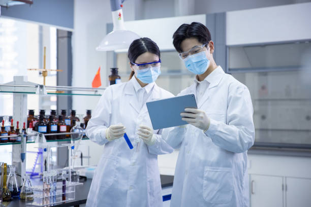 istock Female and male scientists working in a laboratory 1390791126